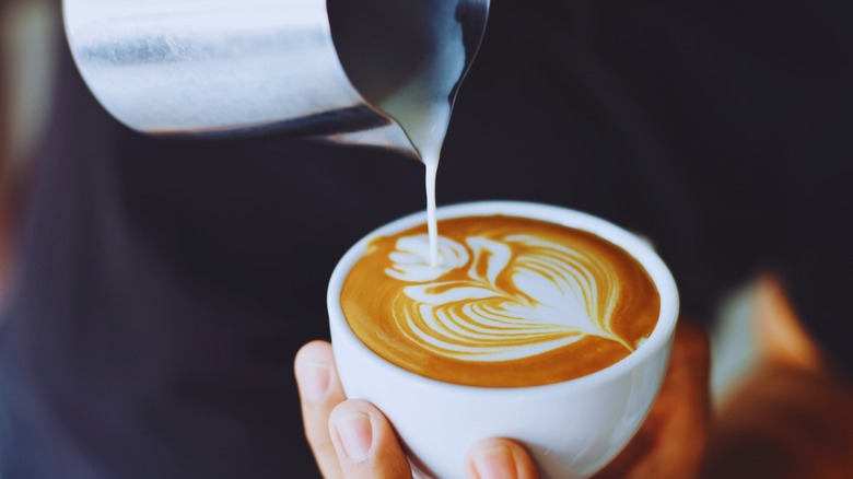 Person making a latte