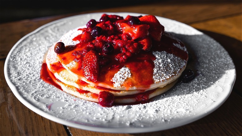 Pancakes covered in berry compote