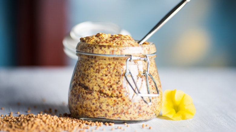 Whole grain mustard in glass jar