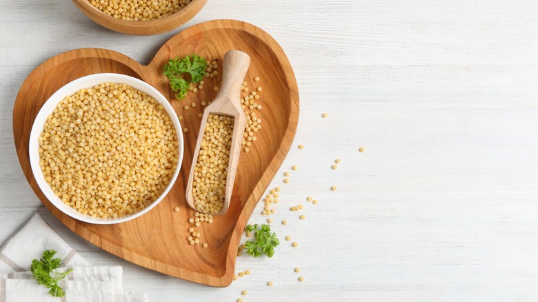 pearl couscous in wooden bowl