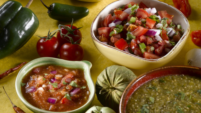 Three different bowls of salsas