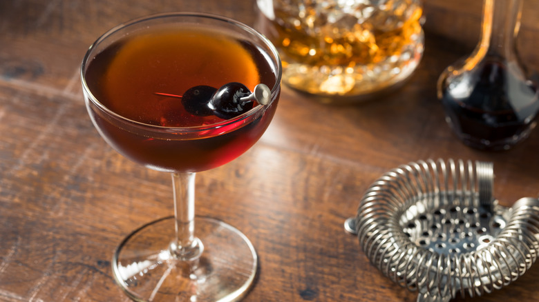 Manhattan cocktail in glass with Luxardo cherries