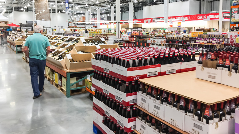 Customer wandering through the liquor section at Costco