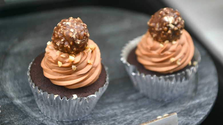 Chocolate cupcakes topped with Nutella frosting and Ferrero Rocher chocolates
