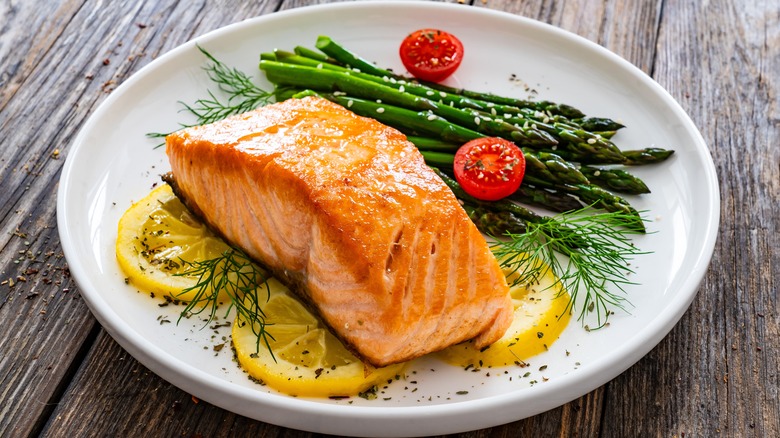 Fried salmon steak with asparagus