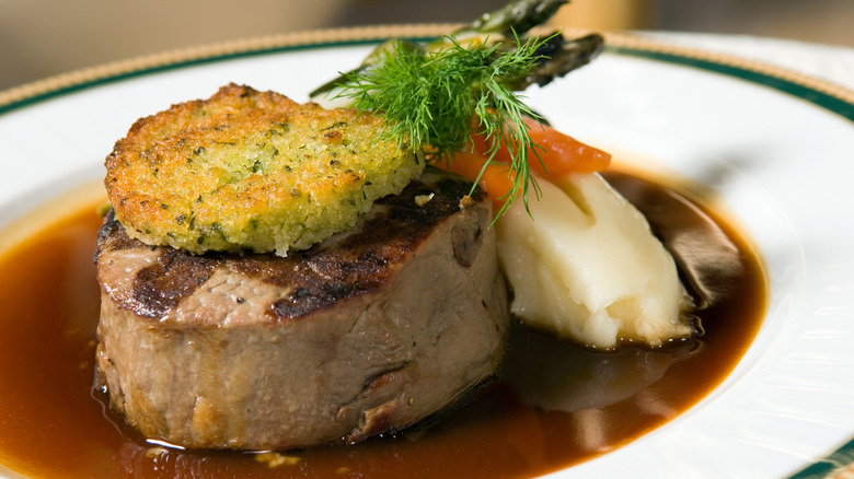 Cooked filet mignon steak with a horseradish crust