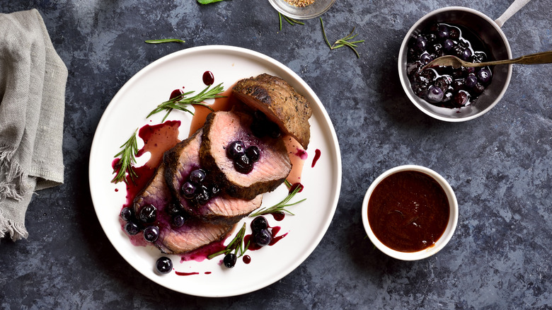 grilled meat with blueberry barbecue sauce