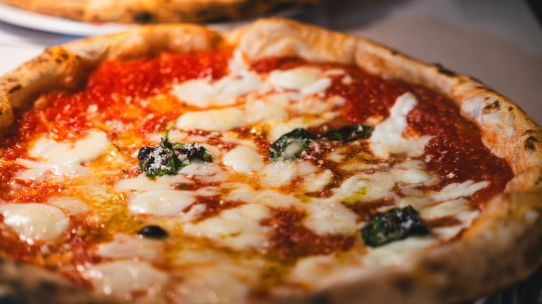 A Neapolitan-style pizza topped with basil