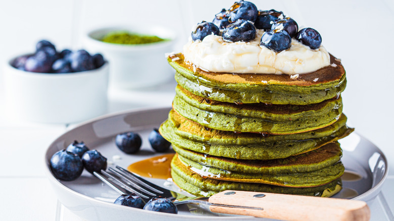 green pancakes with blueberries