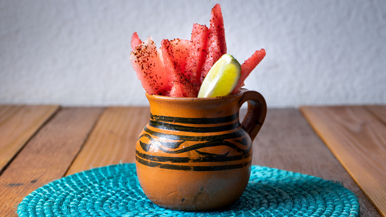 Watermelon spears with Tajin chili and lime