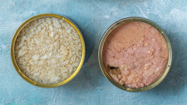 Open cans of tuna side by side