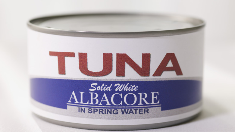 can of tuna on white background