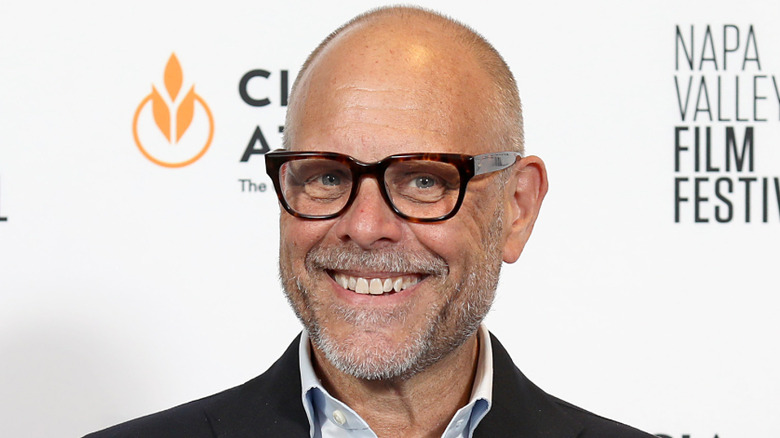 Alton Brown smiles while on a red carpet for the Napa Valley Film Festival