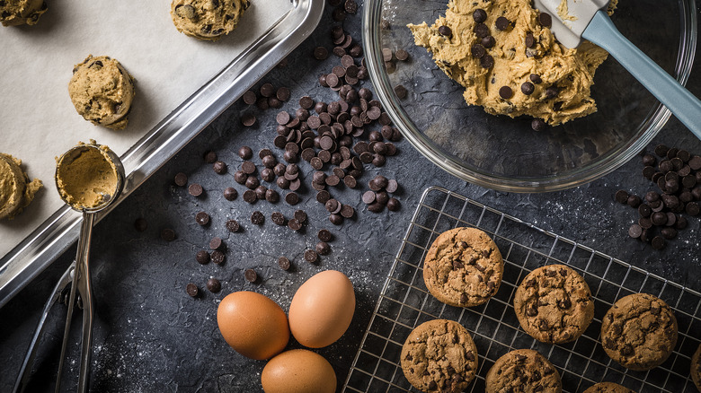 Chocolate chip cookie dough with baked cookies