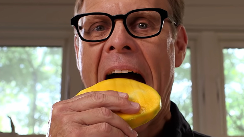 Alton Brown eating mango