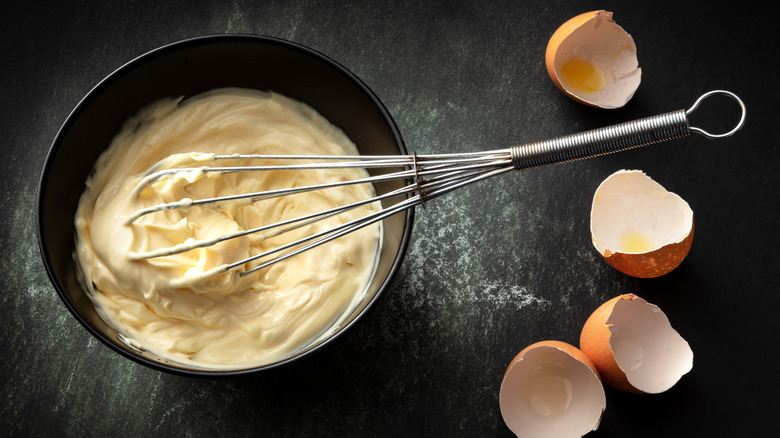 bowl of mayonnaise with whisk