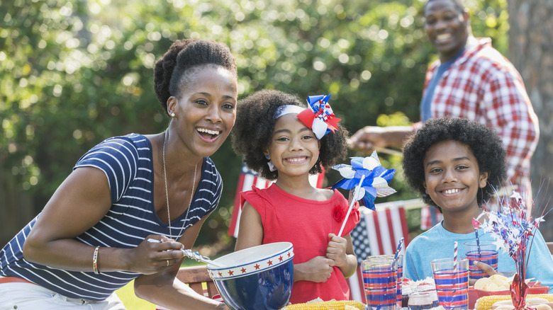 young African American family celebrating Labor Day with a barbecue