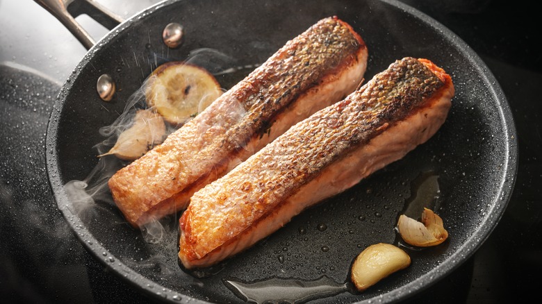 crispy skinned salmon in pan