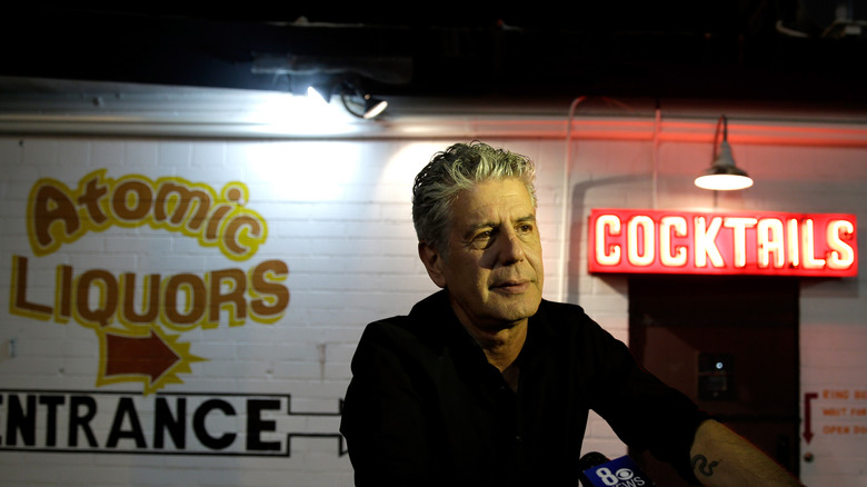 Bourdain outside of a bar