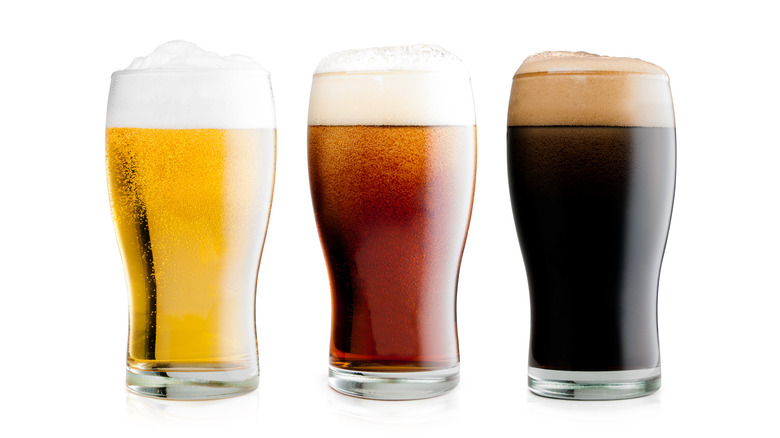 Three glasses of different colored beers