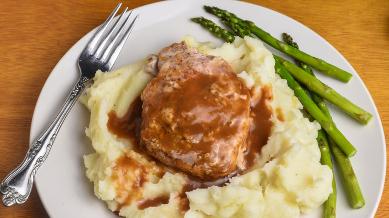 Pork chop with gravy on mashed potatoes