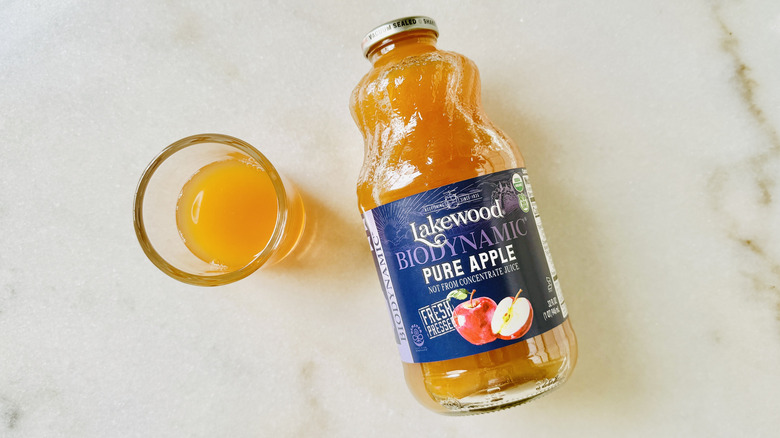 Lakewood Biodynamic Pure Apple Juice bottle and juice glass