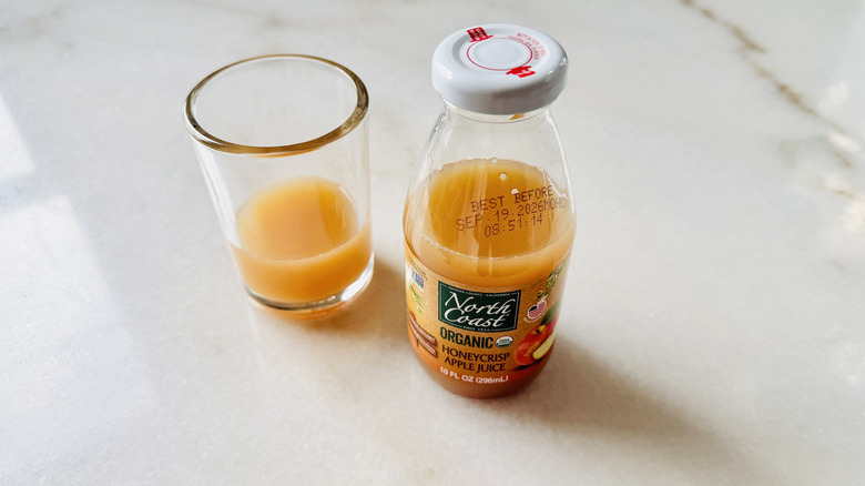 North Coast Organic Honeycrisp Apple Juice bottle with juice glass