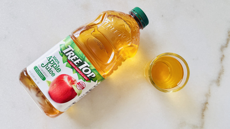 Tree Top 100% Apple Juice jug and juice glass