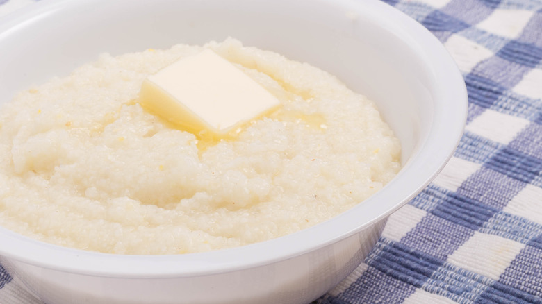 Bowl of white grits with butter