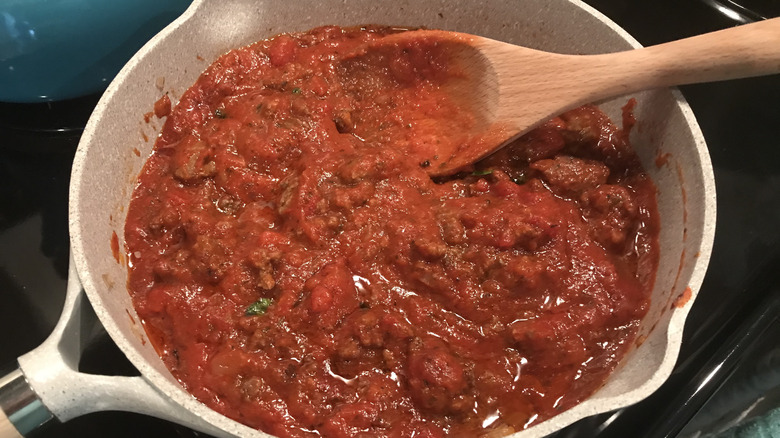 cooking tomato sauce on the stove