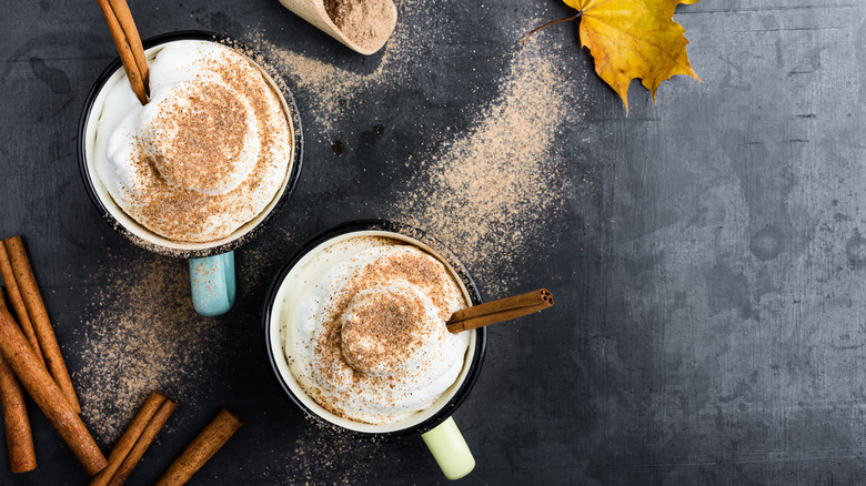 pumpkin spice lattes on black countertop