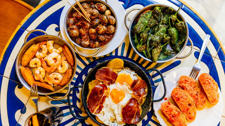 five small plate dishes served on a circular table