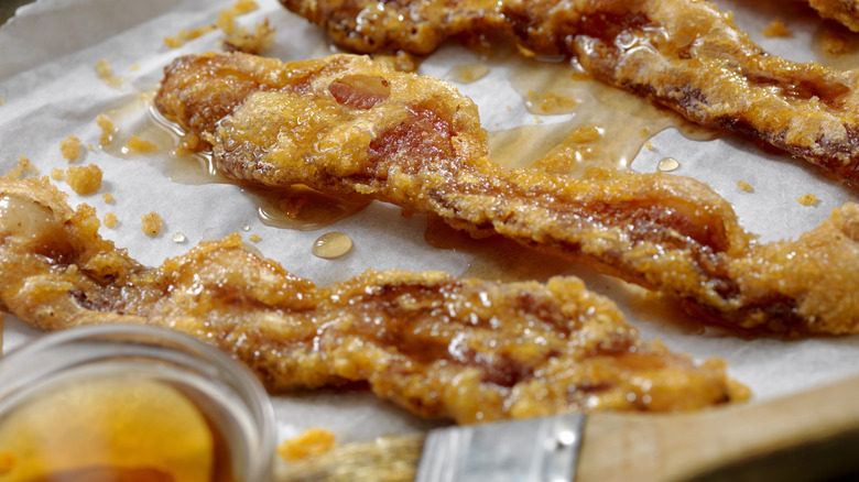 Maple syrup glazed fried bacon slices 