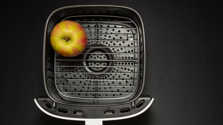 Whole apple in air fryer basket