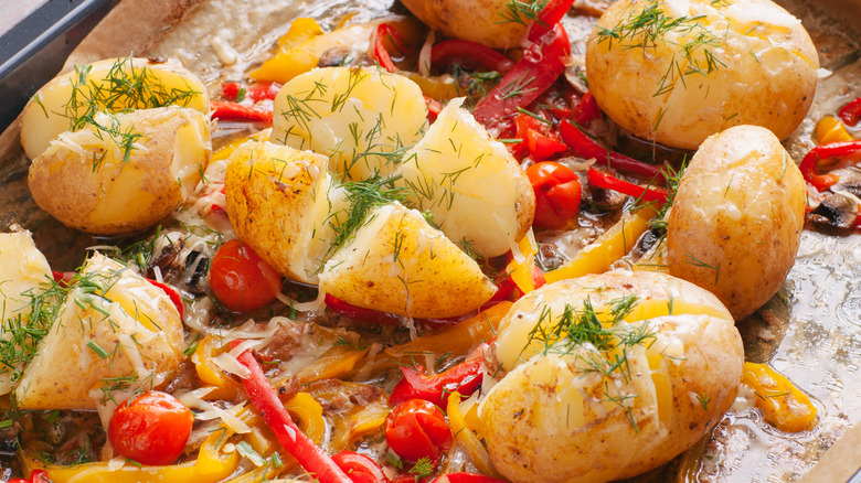 Pan of baked potatoes with veggies