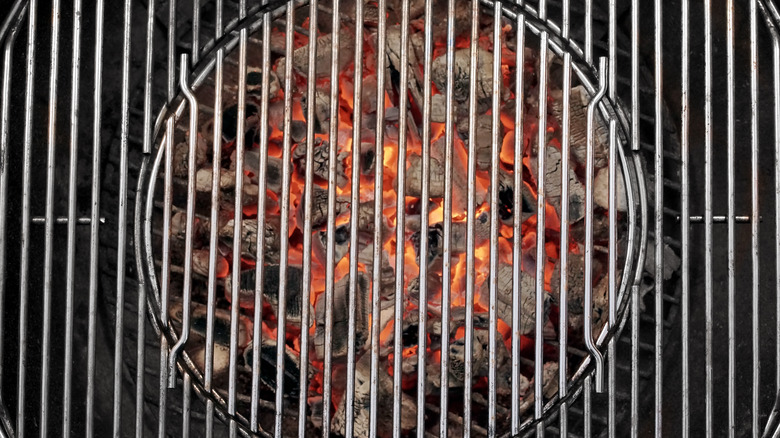barbecue grill rack with coals underneath