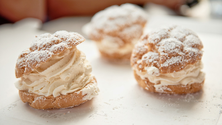 Cream puffs filled with Bavarian cream and dusted with powdered sugar