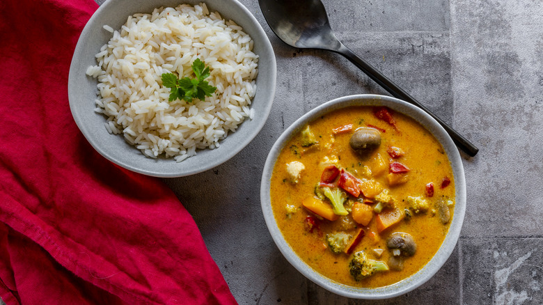 Vegetable curry and rice in bowls