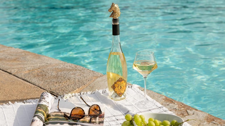 Bottle of honey wine by pool