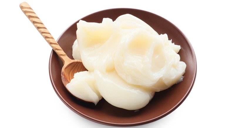 beef tallow in a bowl with a spoon