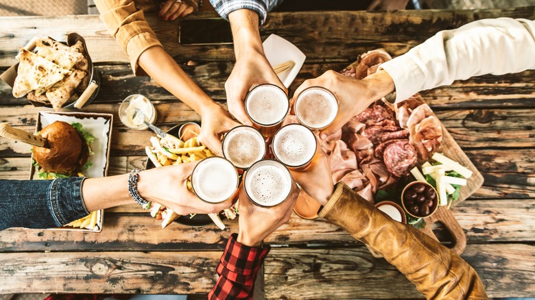 Friends toasting with beer glasses