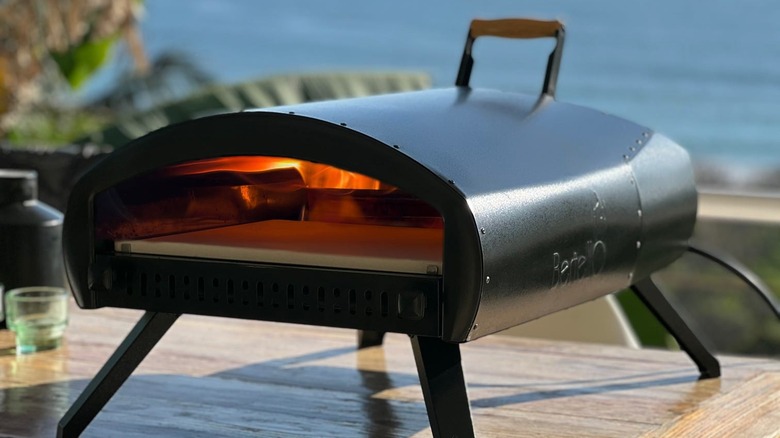 Bertello pizza oven on outdoor table