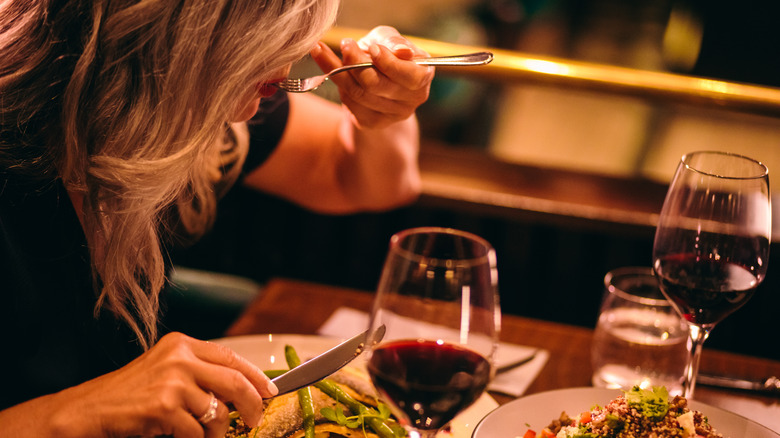 Woman eating at a fancy restaurant