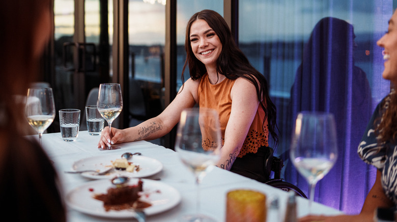 Friends enjoy dessert and drinks at high-end restaurant