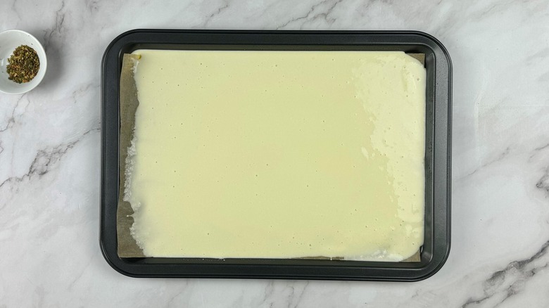 egg cheese mixture on baking sheet