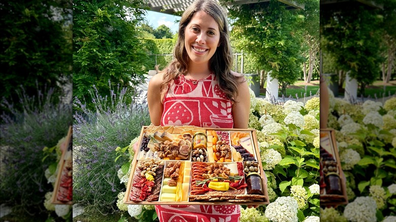 Woman posing with Boarderie charcuterie