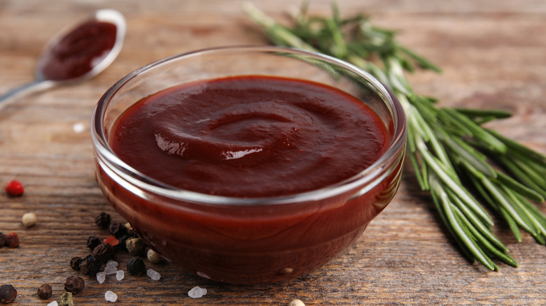 Barbecue sauce in glass bowl on table