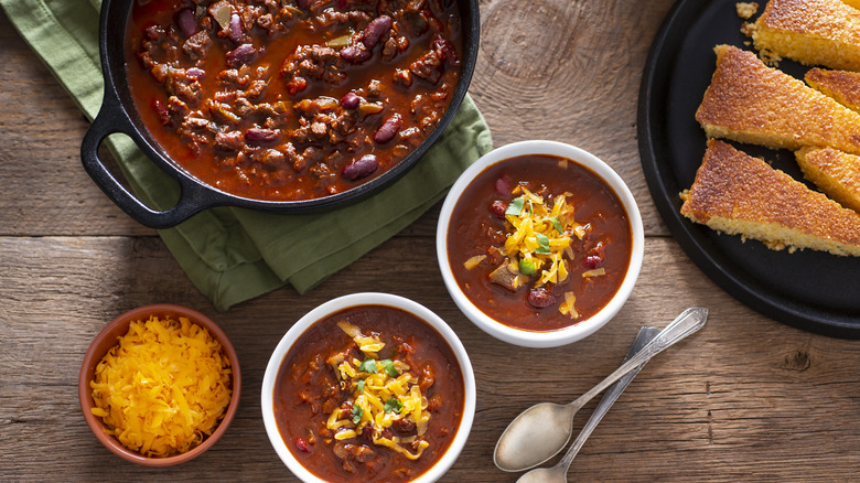 Bowls of chili topped with cheese