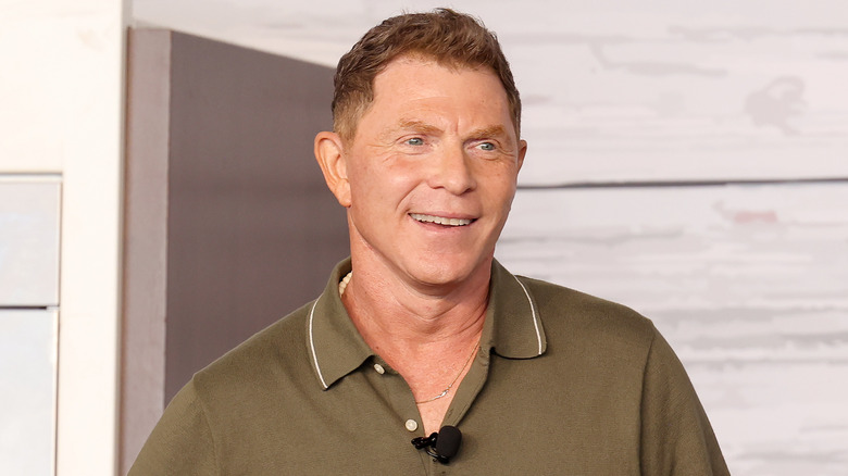 Bobby Flay smiling on stage