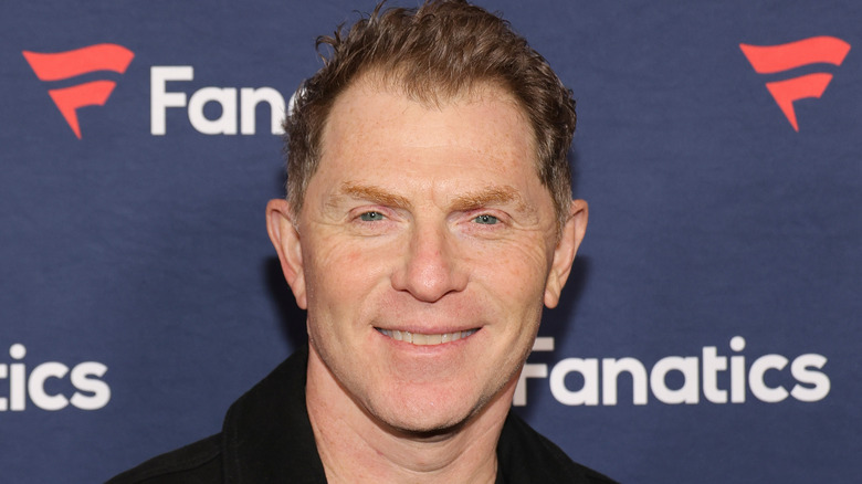 Bobby Flay smiling on red carpet